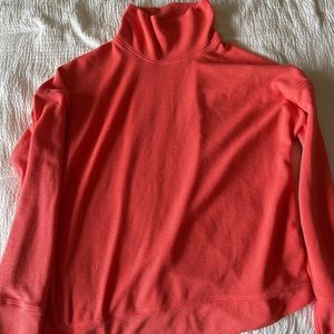 Coral colored rabbit running shirt.